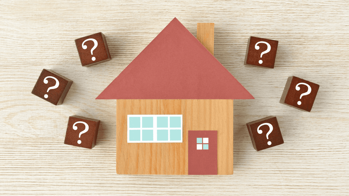 wooden block house surrounded by question mark blocks